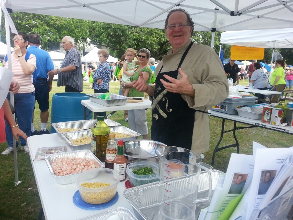 Chef Patrick “famous in these parts” Mould cooks up some healthy samples during Saturday’s Delcambre Seafood & Farmers Market