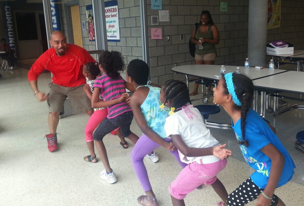 Coach Wood shows off a few moves to the kids of GRoW!