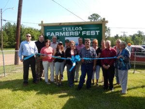 Ribbon cutting ceremony launches Tullos Farmers’ Fest. Let the fruit and veggie sales begin!