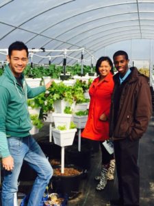 Ebony NeNe Williams tours the Iberia Community Garden Co-op, with co-op leader Phanat Xanamane and DeLane Ross of Southern University AgCenter/LSU AgCenter. The co-op is one of three in Iberia Parish that will supply produce for the new west end food hub. 