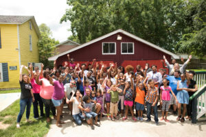BCBS Foundation grant recipients posing in front of a barn.