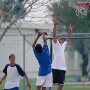 Boys playing basketball.
